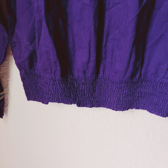 Purple, with gold and aqua color design stitching. Long sleeve crop top. - Picture 5 of 7